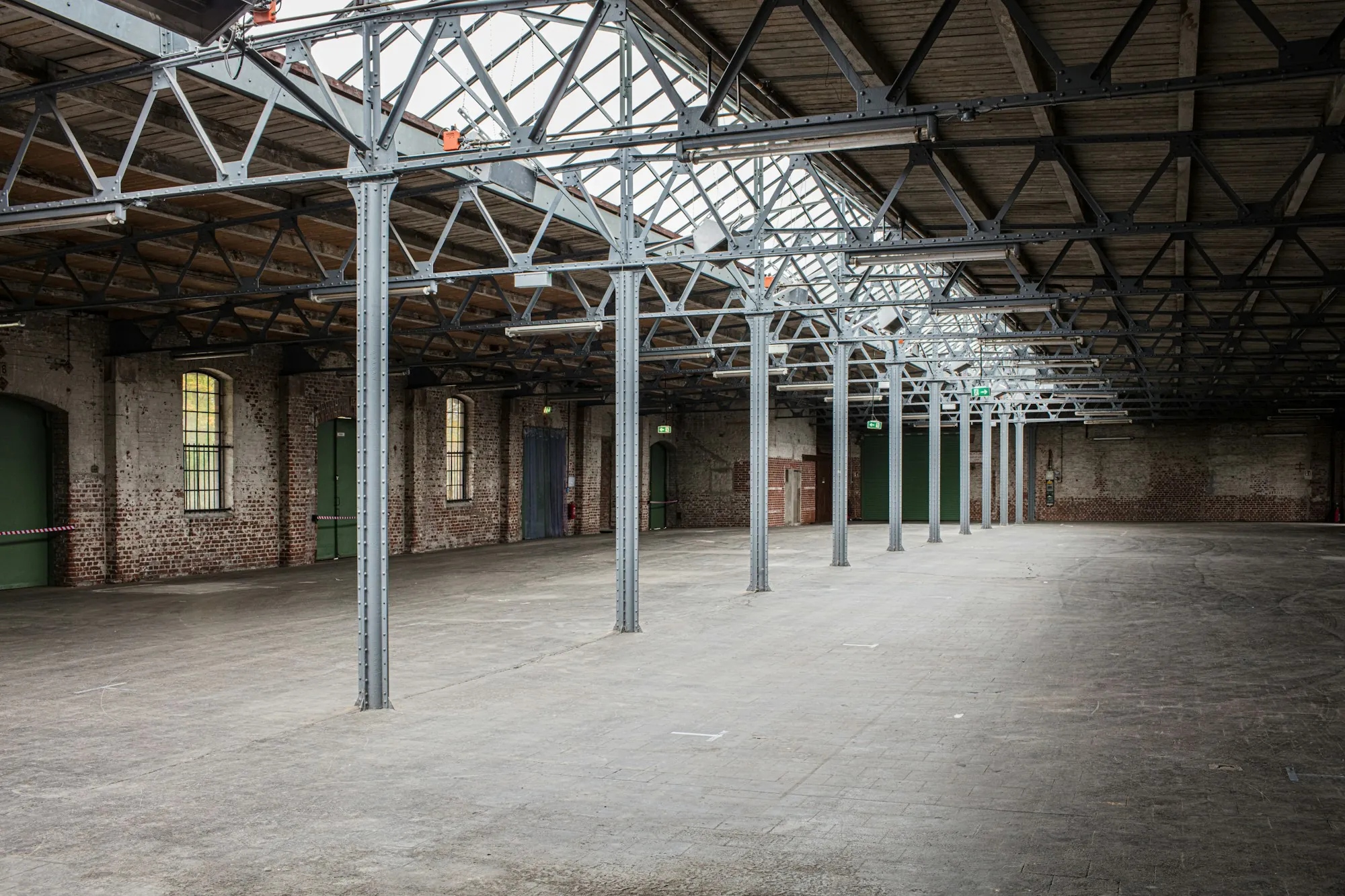 Spacious warehouse with steel columns and natural light